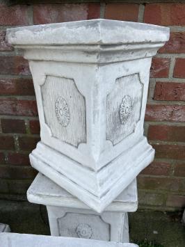 Pedestal pillar console made of solid cast stone.