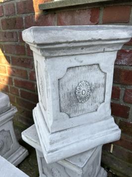 Pedestal pillar console made of solid cast stone.