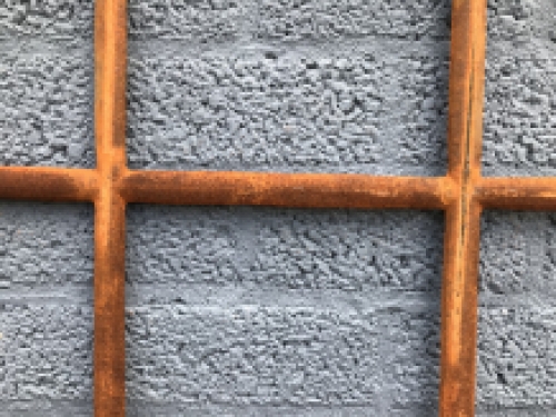 Cast iron window fitted with arches, stable window.