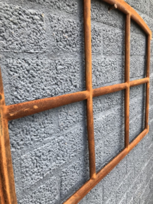 Cast iron window fitted with arches, stable window.