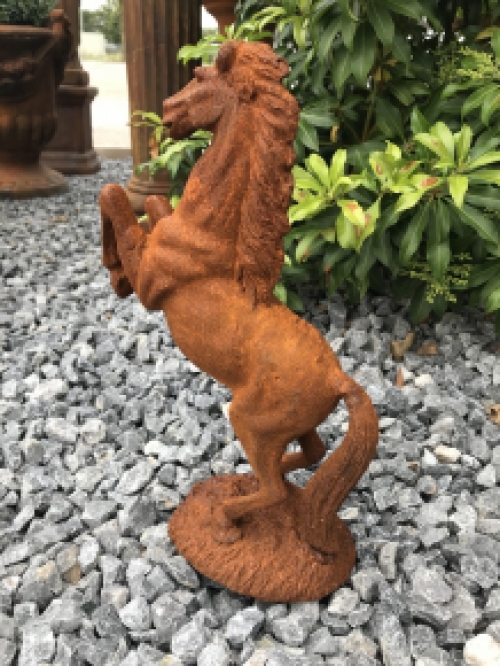 A beautiful statue of a rearing horse, cast iron rest