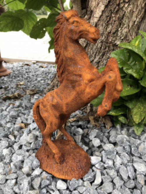 A beautiful statue of a rearing horse, cast iron rest