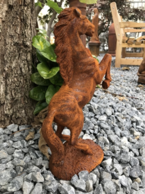 A beautiful statue of a rearing horse, cast iron rest