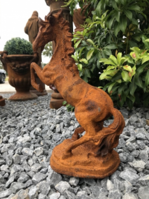 A beautiful statue of a rearing horse, cast iron rest