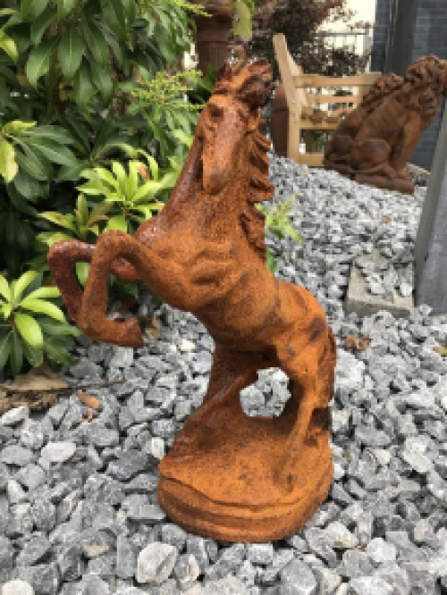 A beautiful statue of a rearing horse, cast iron rest