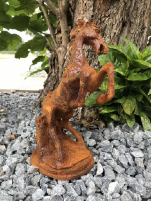 A beautiful statue of a rearing horse, cast iron rest