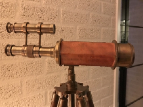 Beautiful decorative telescope on a wooden tripod