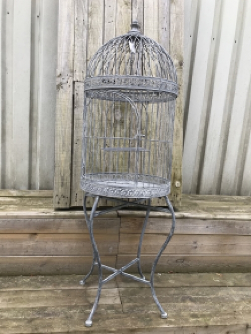 A very pretty decorative birdcage made of iron