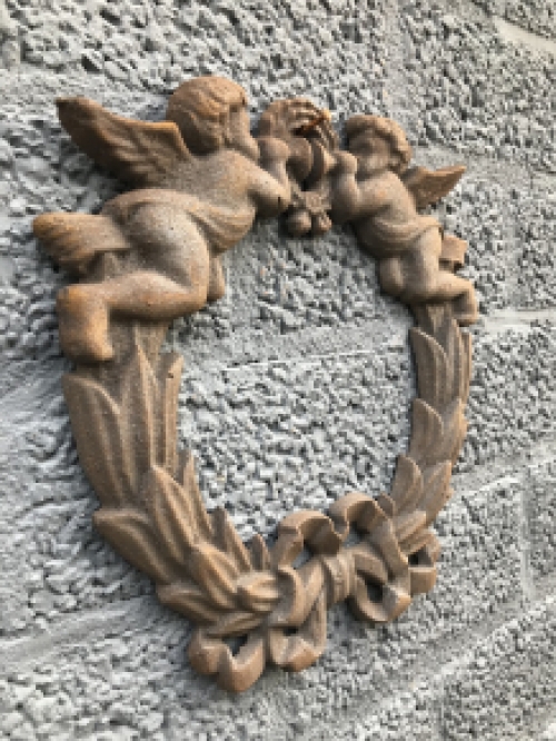 Wall ornament angel scene, cast iron.