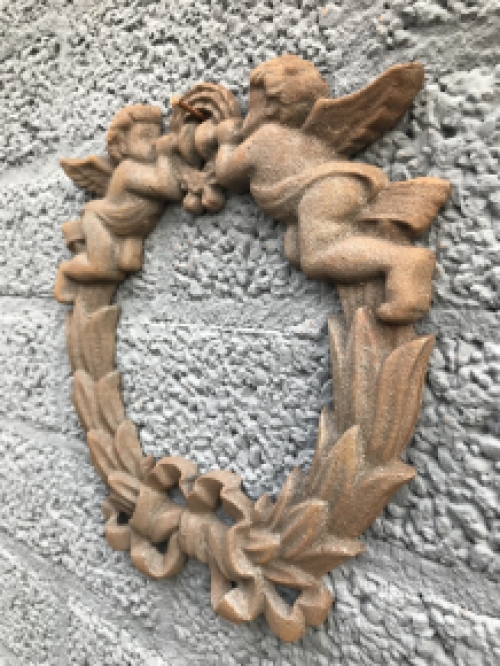 Wall ornament angel scene, cast iron.