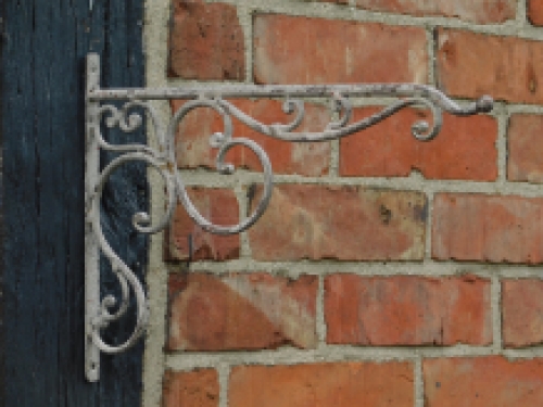 Ornate curved hanging basket wall hook - aged metal