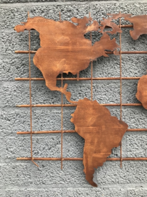 An iron wall rack with a world map on it, robust appearance