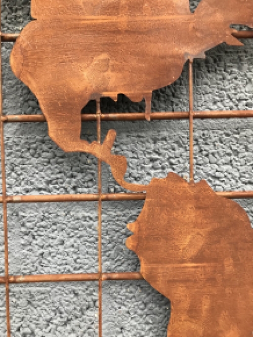 An iron wall rack with a world map on it, robust appearance