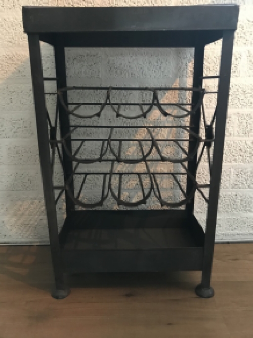 An antique wine rack, metal wine holder for 9 bottles of wine