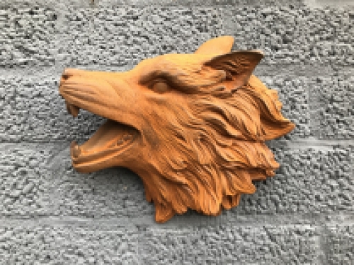 Wolf head, cast iron wall ornament with a rustic surface