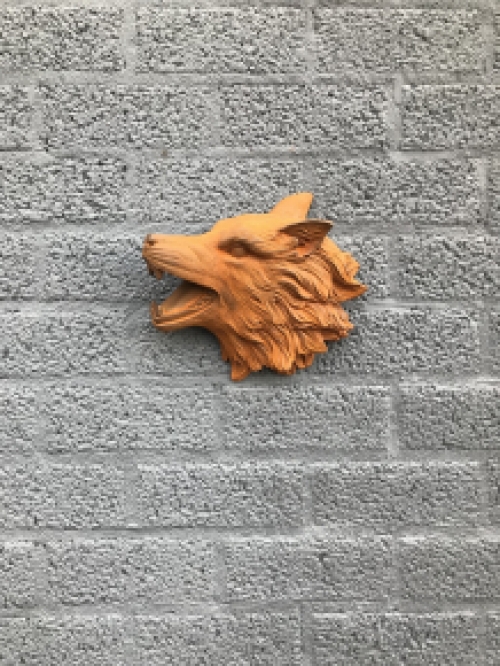 Wolf head, cast iron wall ornament with a rustic surface